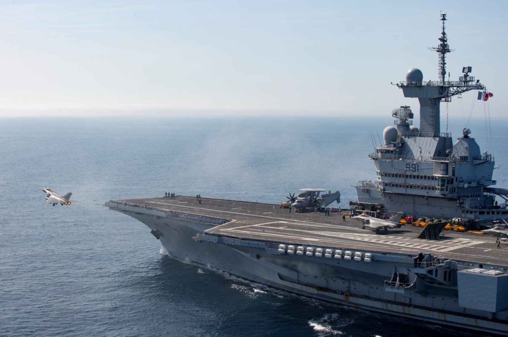 On 13th March 2019, the French Carrier Strike Group, CTF473 arrived off-shore Syria to support Combined Joint Task Force Operation Inherent Resolve. The Carrier Strike Group is composed of the Aircraft carrier Charles-de-Gaulle, the Danish frigate Daniel Juel, and an attack submarine among other assets. The Charles-de-Gaulle launched Rafale Marine and Hawkeye aircraft to support coalition troops on the ground and gather intelligence while other air assets and vessels were conducting air and maritime control operations.

The arrival of the CSG reinforces French military capabilities involved in Operation CHAMMAL and strengthens the Coalition against ISIS. The French air carrier group is familiar with this theater of operations in the Levant since it has already conducted three previous Arromanches missions since January 2015, which is a significant commitment to the military campaign against ISIS. This capacity building illustrates the determination of France and the coalition to complete the military defeat of ISIS.