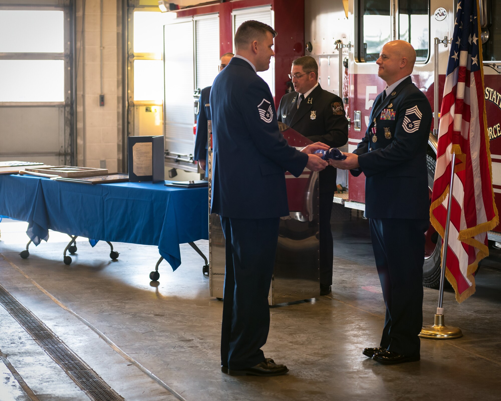 Chief Otto receives his retirement flag.