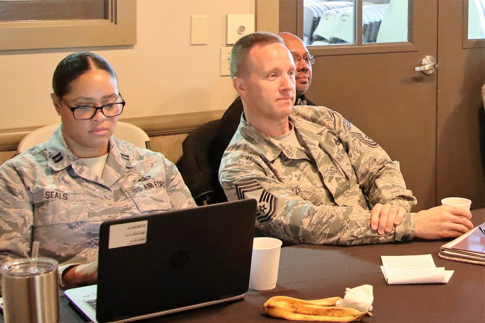 Executive officer to the 340th Flying Training Group commander Capt. Yolanda Seals, 340th FTG superintendent Chief Master Sgt. Scott Goetze and group resource advisor Anthony Griffin sit in on one of the briefings during the 340th FTG semi-annual commanders’ summit held March 4-7 in Fredericksburg, Texas. (U.S. Air Force photo by Janis El Shabazz)