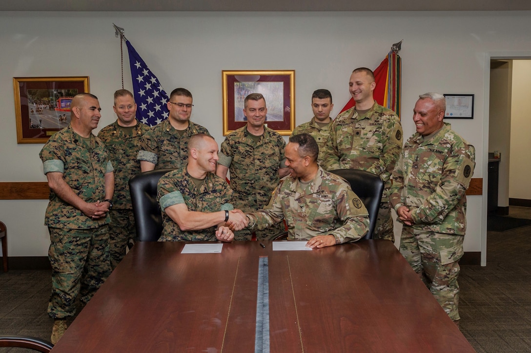 Colonel Craig Clemans, Base Commander, and Col. Larry O. France, Commander, Weed Army Medical Center, shake hands after signing a Memorandum of Agreement which states that the hospital agrees to provide medical services to the MCLB Marines The signing took place March 12 aboard Marine Corps Logistics Base Barstow, California.
(U.S. Marine Corps photo by Jack J. Adamyk)