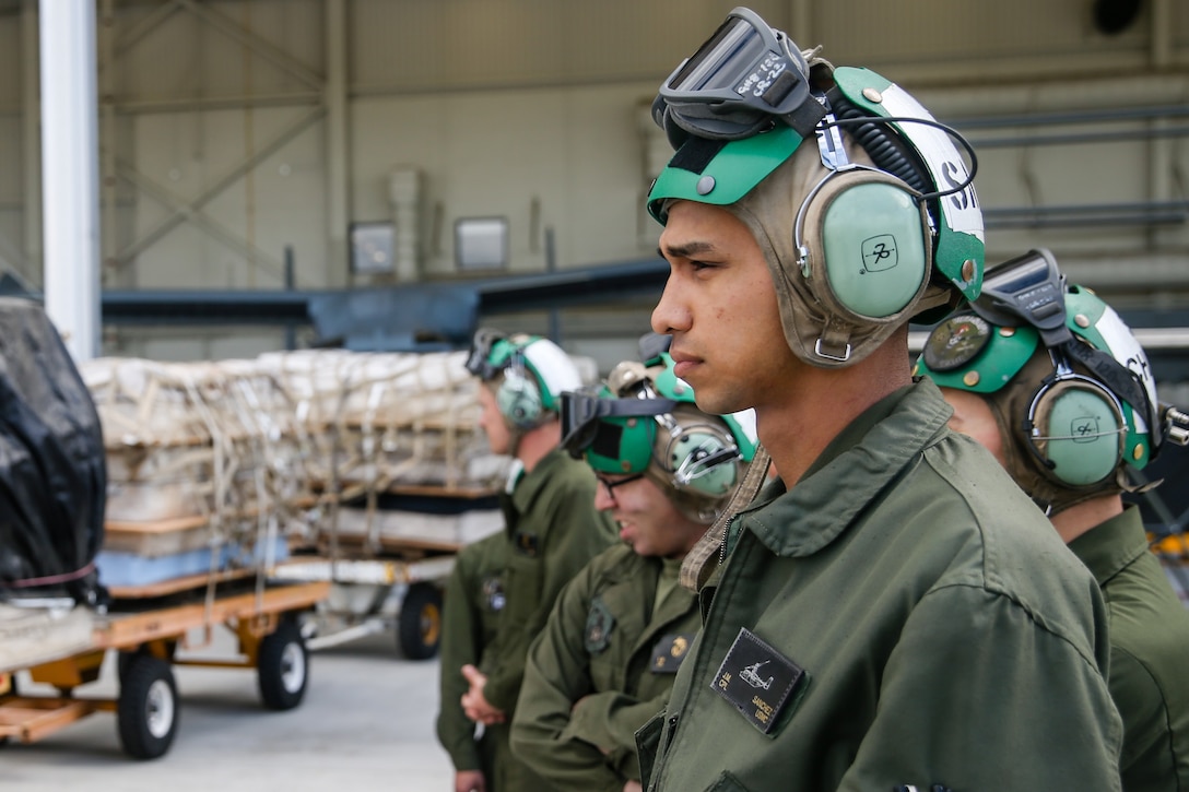 U.S. Marine Corps Cpl. Julius Sanchez, tiltrotor airframe mechanic with Marine Medium Tiltrotor Squadron 164, Marine Aircraft Group 39, 3rd Marine Aircraft Wing, prepare to conduct an MV-22 Osprey hung gear malfunction drill at Marine Corps Air Station Camp Pendleton, California, March 12, 2019. The purpose of the drill was to ensure that in the event of a landing gear malfunction the pilot, air crew and ground crew would be trained to conduct an emergency landing. (U.S. Marine Corps photo by Lance Cpl. Drake Nickels)