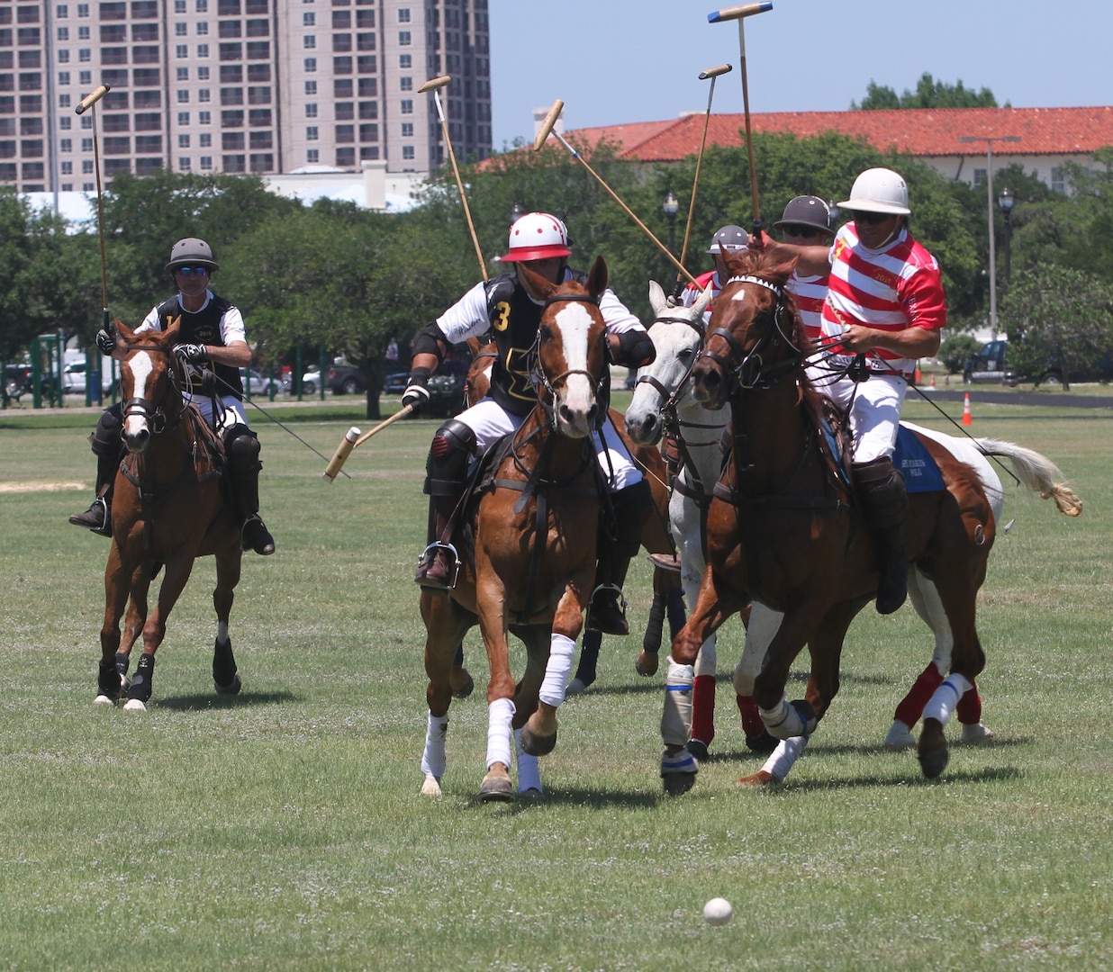 Players charge after a free ball in a polo match May 5, 2018, at Joint Base San Antonio-Fort Sam Houston. The match was the first time polo was played on the base in more than 50 years. A polo match would’ve been a common sight on Army bases in the early 20th century. Notable advocates and players included Gen. John Pershing, Gen. George Patton Jr., and Medal of Honor recipient Col. Gordon Johnston. The USPA created the Col. Gordon Johnston Sportsmanship Award in his honor.