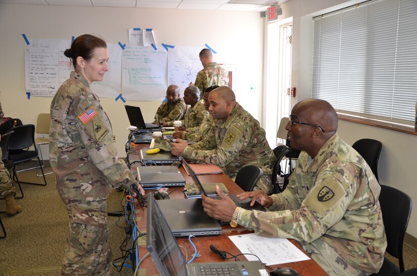 Capt. Beth Appleman, logistics support officer with 1st Logistics Civil Augmentation Program Support Battalion, takes a moment to discuss the importance of understanding the area of operations and requests from the requiring activity