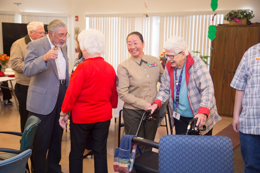 Following her recounting of how her family fled Vietnam at the end of the Vietnam War, Master Sgt. Tianna Tien shares a moment of levity with a Veterans Home of California- Barstow resident. Tien and her family had to flee her native Vietnam after the communist North Vietnamese seized power. The regime then began imprisoning and executing those who had opposed them during the war.
