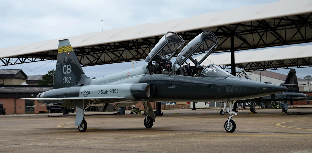 Maj. Andrew Pence, 49th Fighter Training Squadron instructor pilot, and 2nd Lieutenant Kennan Allen, 49th FTS student pilot, move to the runway to begin flight for a training sortie, March 7, 2019, on Columbus Air Force Base, Mississippi. The 49th FTS holds a high standard in Introduction to Fighter Fundamentals to ensure the pilots that leave the squadron are highly capable of adapting and overcoming challenges when needed with their wingmen in an extremely challenging career. (U.S. Air Force photo by Airman Hannah Bean)