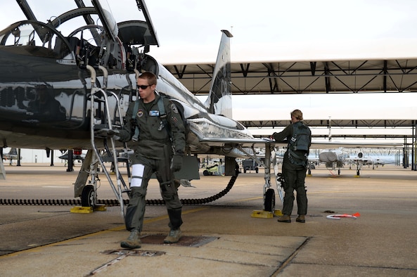 Maj. Michael Overstreet, 49th Fighter Training Squadron assistant director of operations, and Maj. Andrea Matesick, 49th Fight Training Squadron weapons system officer, check over a T-38C Talon in preparation for a sortie March 7, 2019, on Columbus Air Force Base, Mississippi. Pilots dedicate a great deal of time and effort to ensure the aircraft is fully prepared for flight and soundly running. (U.S. Air Force photo by Airman Hannah Bean)