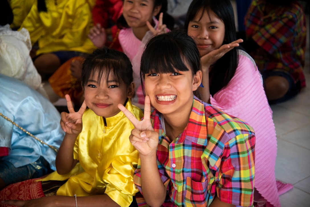 Two Ban PaLai School children pose for a photo during a COPE Tiger 2019 cultural exchange at Korat, Thailand, March 13, 2019.