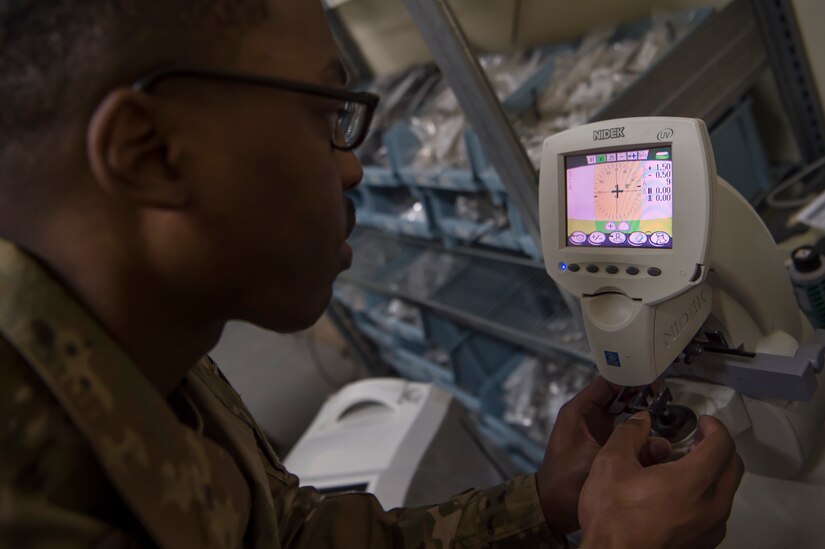 U.S. Army Spc. Justin Jones, 354th Medical Company Logistics Support optical laboratory specialist, 8th Medical Brigade, Area Support Group - Qatar, fabricates lenses for glasses March 9, 2019, at Camp As Sayliyah, Qatar. Jones is part of a team that grinds and frames glasses from data provided by a U.S. Air Force optometry team from Al Udeid Air Base, Qatar. (U.S. Air Force photo by Tech. Sgt. Christopher Hubenthal)