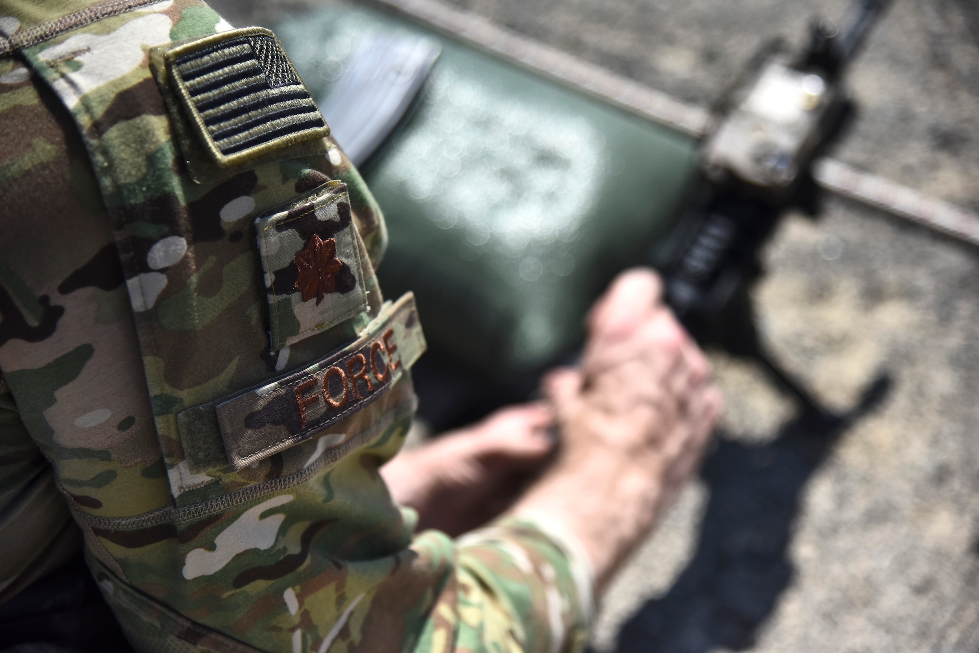 Maj. Michael Force, 380th Expeditionary Security Forces Squadron commander, adjusts the sights on his M4 Carbine weapon at Al Dhafra Air Base, United Arab Emirates, March 8, 2019. The M4 is a lightweight, gas operated, air cooled, magazine fed, selective rate, shoulder fired weapon with a collapsible stock, and is now the standard issue firearm for most units in the U.S. military. (U.S. Air Force photo by Senior Airman Mya M. Crosby)