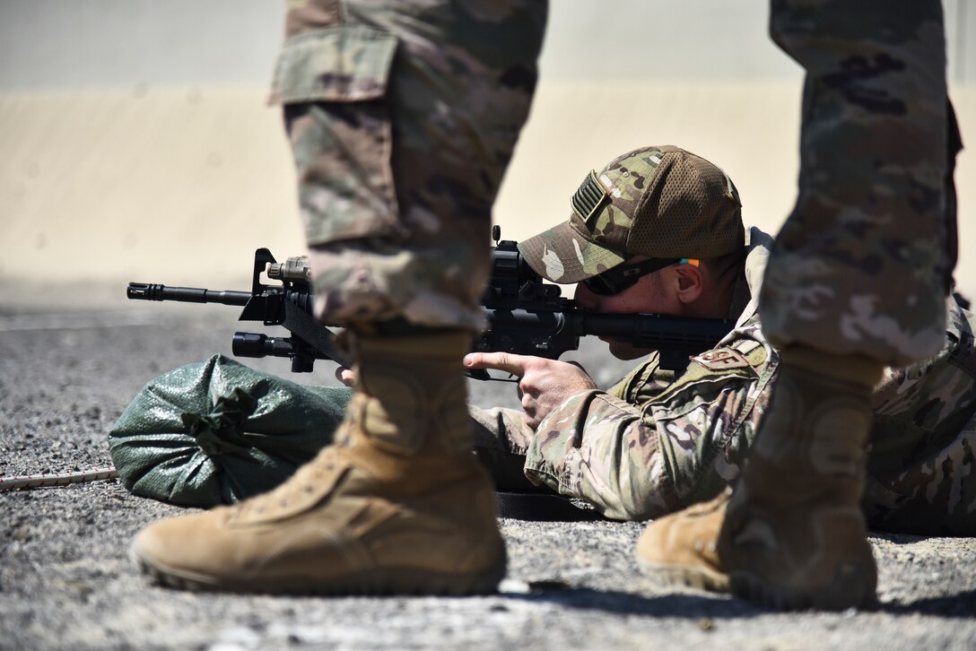 Staff Sgt. Bradley Nendel, 380th Expeditionary Security Forces Squadron, performs an operational check on an M4 Carbine weapon at Al Dhafra Air Base, United Arab Emirates, March 8, 2019. The M4 is a lightweight, gas operated, air cooled, magazine fed, selective rate, shoulder fired weapon with a collapsible stock, and is now the standard issue firearm for most units in the U.S. military. (U.S. Air Force photo by Senior Airman Mya M. Crosby)