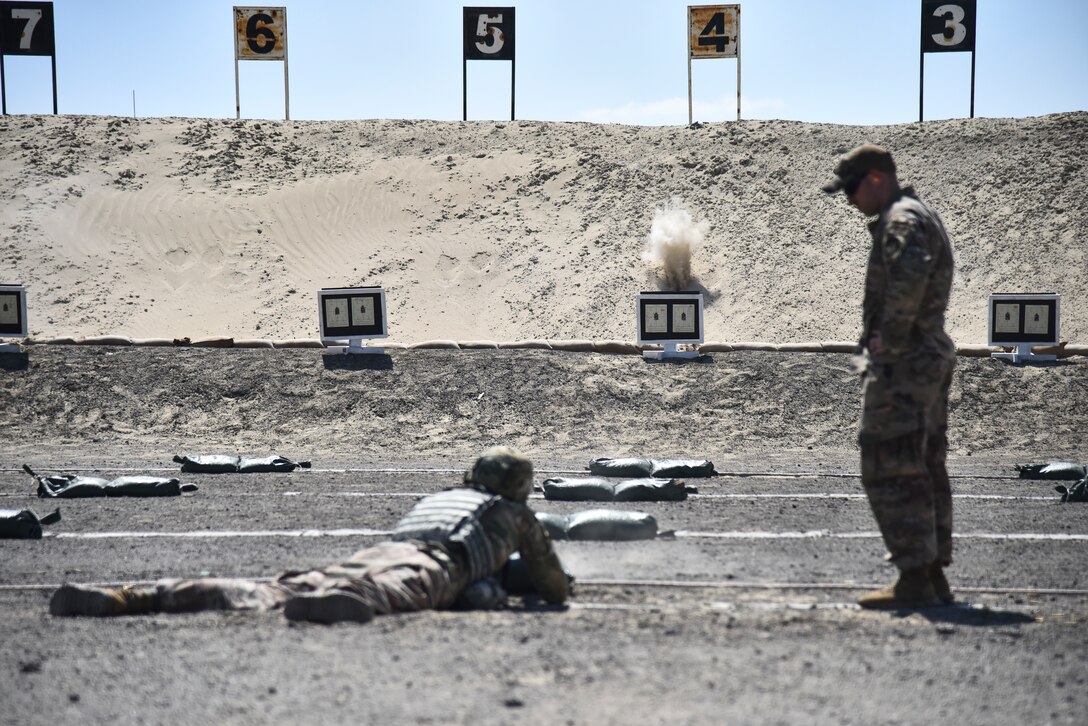 Staff Sgt. Bradley Nendel, 380th Expeditionary Security Forces Squadron NCO in charge of armory, supervises an Airman zeroing their weapon at Al Dhafra Air Base, United Arab Emirates, March 8, 2019. Security Forces Airmen are responsible for missile security, defending air bases around the globe, law enforcement on those bases, combat arms and handling military working dogs. (U.S. Air Force photo by Senior Airman Mya M. Crosby)