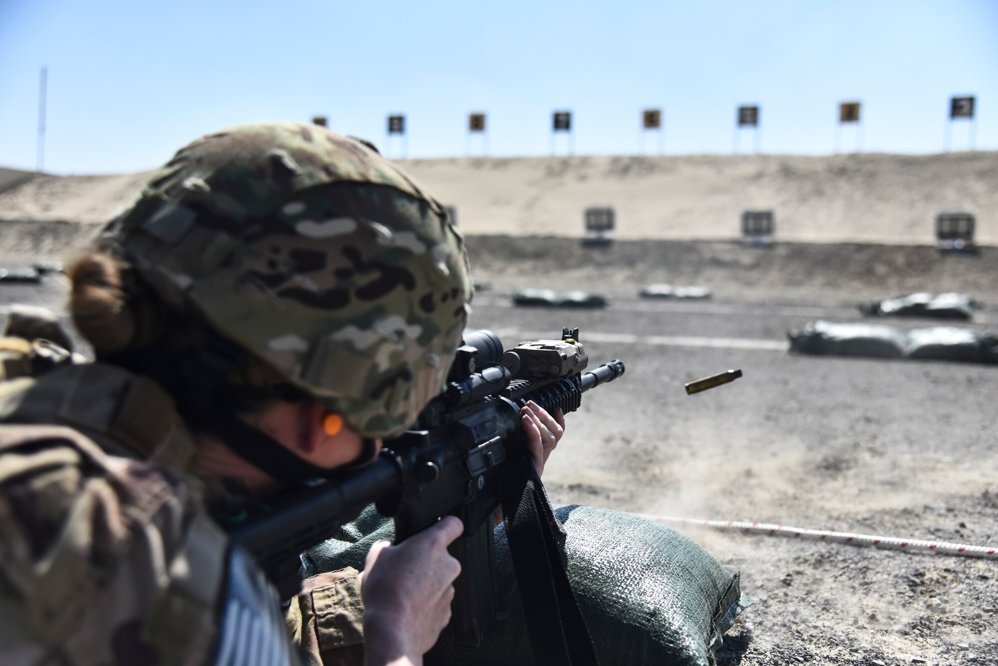 Master Sgt. Leigh Weigold, 380th Expeditionary Security Forces Squadron section chief of plans and programs, fires her weapon at Al Dhafra Air Base, United Arab Emirates, March 8, 2019. As the largest career field in the Air Force, it’s the job of Security Forces to protect, defend and fight to enable U.S. Air Force, Joint and Coalition missions. (U.S. Air Force photo by Senior Airman Mya M. Crosby)