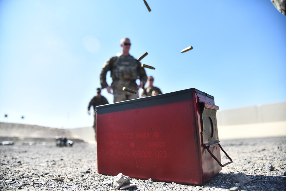 Airmen assigned to the 380th Expeditionary Security Forces Squadron dispose brass bullet casings at Al Dhafra Air Base, United Arab Emirates, March 8, 2019. Security Forces Airmen are responsible for missile security, defending air bases around the globe, law enforcement on those bases, combat arms and handling military working dogs. (U.S. Air Force photo by Senior Airman Mya M. Crosby)
