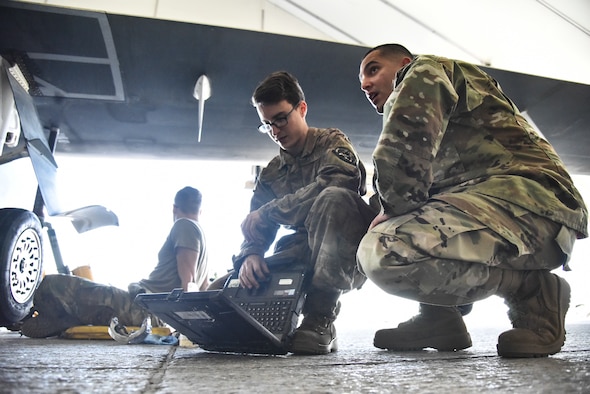 Staff Sgt. Luis Rosa, 380th Expeditionary Maintenance Group RQ-4 Global Hawk and U-2 Dragon Lady quality assurance inspector, inspects an RQ-4 Global Hawk and its crew at Al Dhafra Air Base, United Arab Emirates, March 12, 2019. QA is responsible to the Maintenance Group commander or equivalent to perform as the primary technical advisory agency for maintenance actions and to assist work center supervisors in reviewing tasks involved in supporting the maintenance effort. (U.S. Air Force photo by Senior Airman Mya M. Crosby)