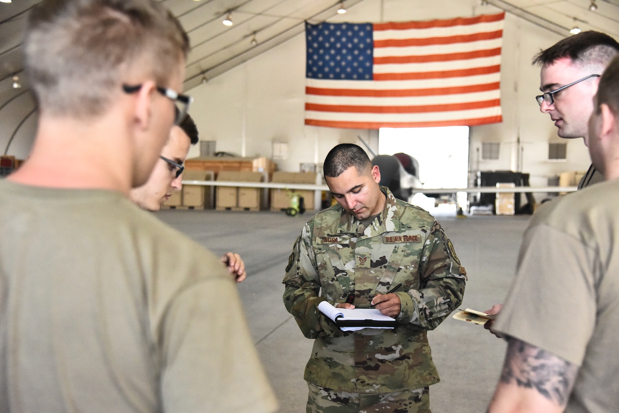 Staff Sgt. Luis Rosa, 380th Expeditionary Maintenance Group RQ-4 Global Hawk and U-2 Dragon Lady quality assurance inspector, inspects an RQ-4 Global Hawk maintenance crew at Al Dhafra Air Base, United Arab Emirates, March 12, 2019. The QA staff evaluates the quality of maintenance accomplished and performs necessary functions to manage the Maintenance Standardization Evaluation Program. (U.S. Air Force photo by Senior Airman Mya M. Crosby)