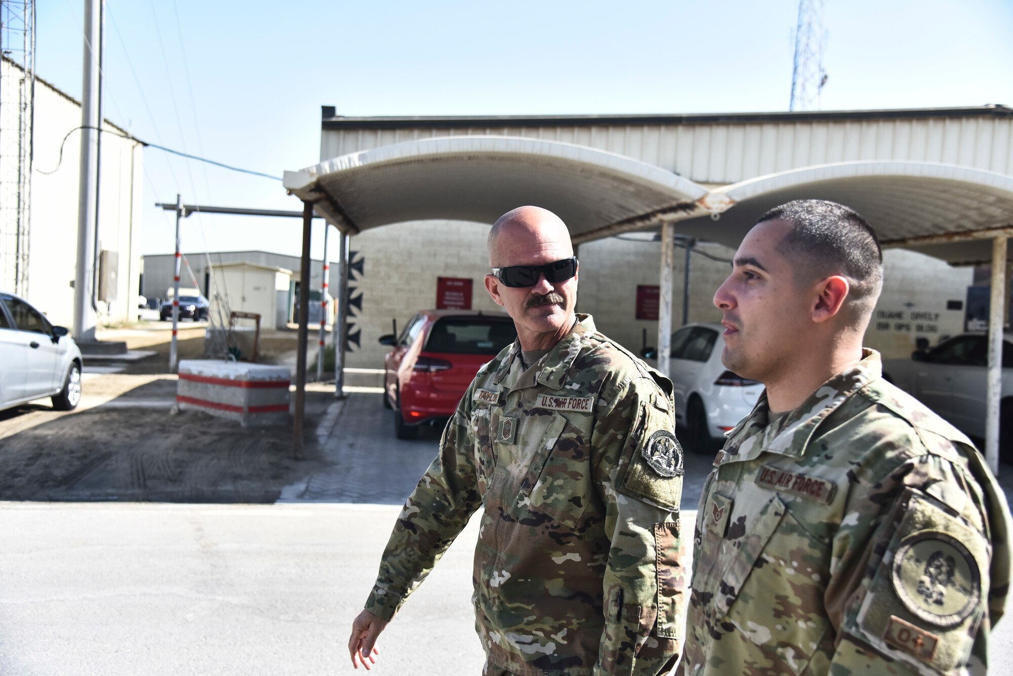 Staff Sgt. Luis Rosa, 380th Expeditionary Maintenance Group RQ-4 Global Hawk and U-2 Dragon Lady quality assurance inspector, briefs Senior Master Sgt. Robert Taylor, 380th Expeditionary Aircraft Maintenance Squadron RQ-4 Global Hawk aircraft maintenance unit superintendent, on an inspection on his Airmen at Al Dhafra Air Base, United Arab Emirates, March 12, 2019. The QA staff evaluates the quality of maintenance accomplished and performs necessary functions to manage the Maintenance Standardization Evaluation Program. (U.S. Air Force photo by Senior Airman Mya M. Crosby)