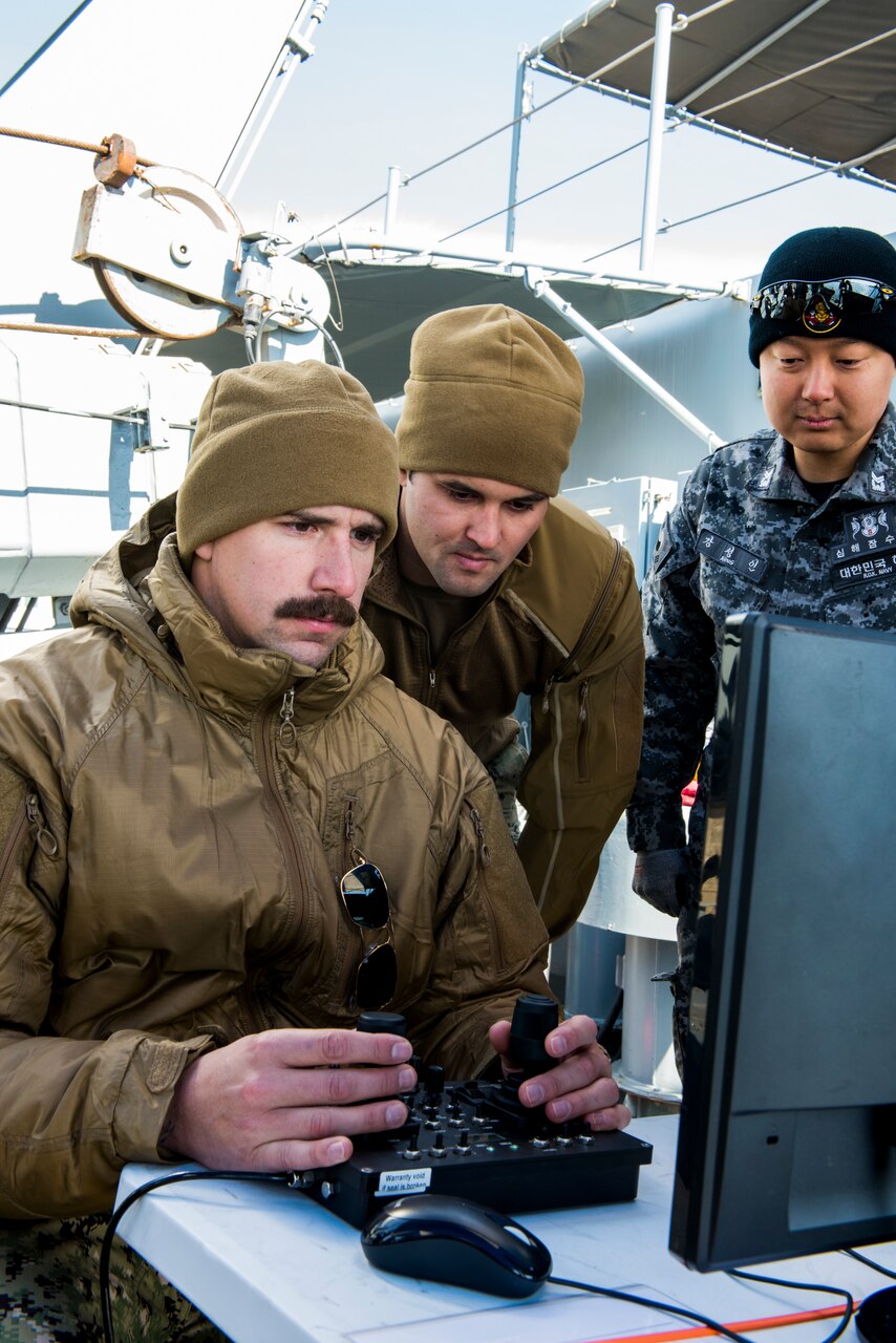 CHINHAE, Republic of Korea (March 14, 2019) Navy Diver 2nd Class Andre Rabideau, assigned to Mobile Diving Salvage Unit 1, Company 1-5, pilots a Republic of Korea navy remote operated vehicle (ROV) during an ROV training evolution.