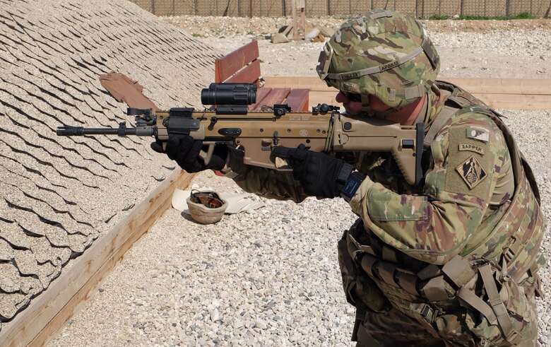 Staff Sergeant (P) Andrew Pretty trains on the SCAR-L Long Barrel Rifle system prior to entering the reflexive firing lane.