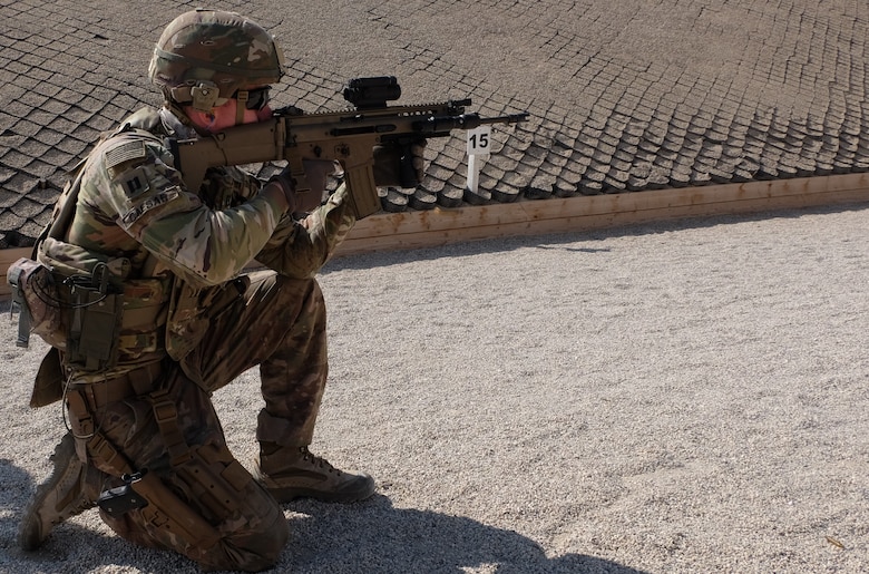 CPT Nick Caesar executes a reflexive firing lane with the SCAR-L Long Barrel Rifle system after a period of training given by the Belgian Coalition partners.