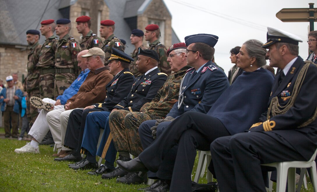 U.S., German and French dignitaries at a ceremony in Picauville, France