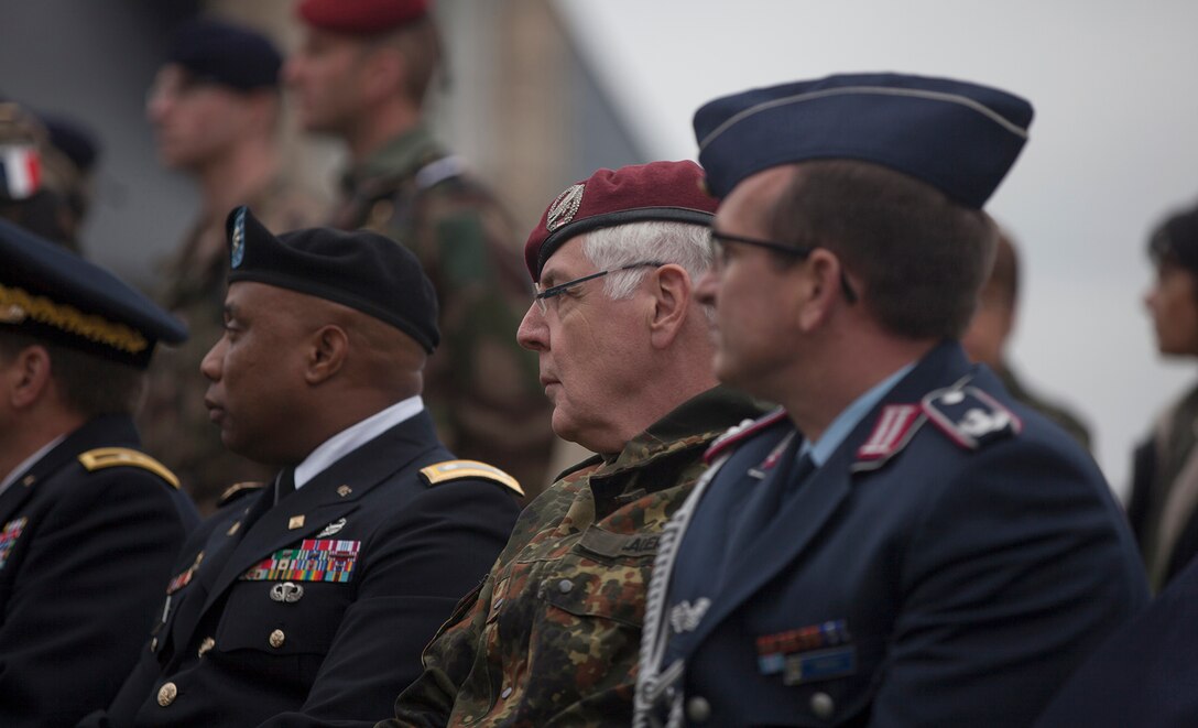 U.S., German and French dignitaries at a ceremony in Picauville, France