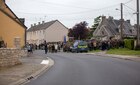 Multinational military and civilians in a ceremony in Picauville, France