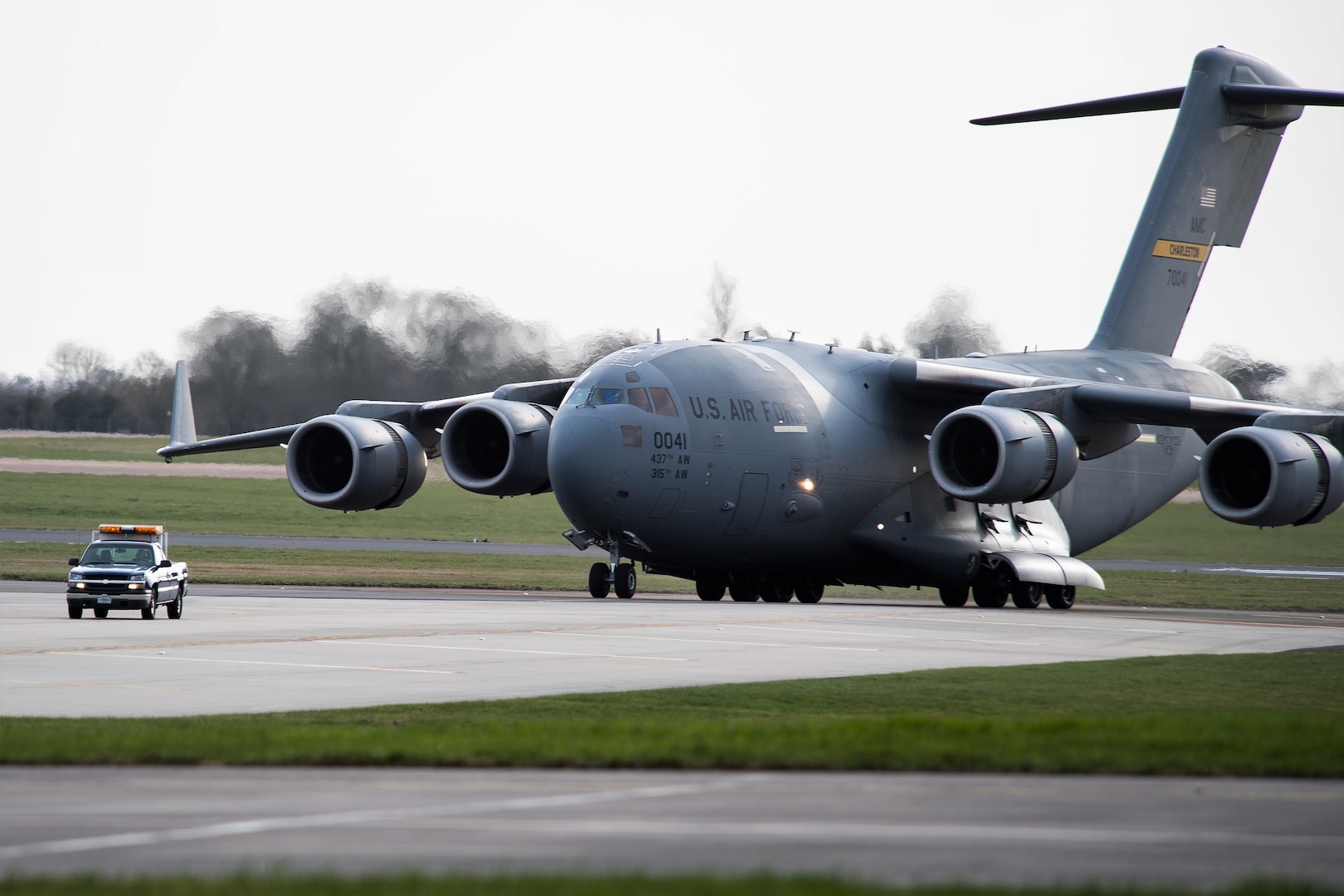 A C-17 Globemaster III from Charleston Air Force Base, S.C., taxis down the flight line at RAF Fairford, England, March 9, 2019. Multiple C-17s were required to deliver all the support equipment needed to support the U.S. Strategic Command Bomber Task Force (BTF) in Europe. (U.S. Air Force photo by Airman 1st Class Tessa B. Corrick)