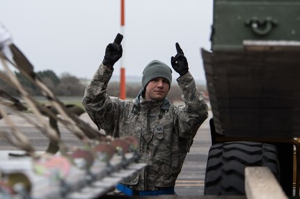Staff Sgt. Scot Boone, 2nd Logistics Readiness Squadron training validation and operation noncommissioned officer in charge, deployed from Barksdale Air Force Base, La., directs a 2nd LRS vehicle operator at RAF Fairford, England, March 9, 2019. The team loaded cargo to deliver to various units on base to begin U.S. Strategic Command Bomber Task Force (BTF) in Europe.