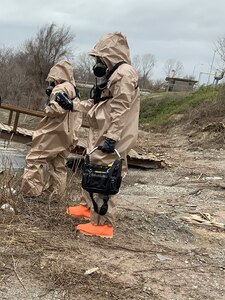 Two members of the 61st Civil Support Team, 87th Troop Command, Arkansas National Guard, don HAZMAT suits and search for chemical spills during a training exercise in West Memphis, Arkansas on March 13, 2019. The unit was involved in a New Madrid earthquake response exercise alongside several civilian emergency response agencies.