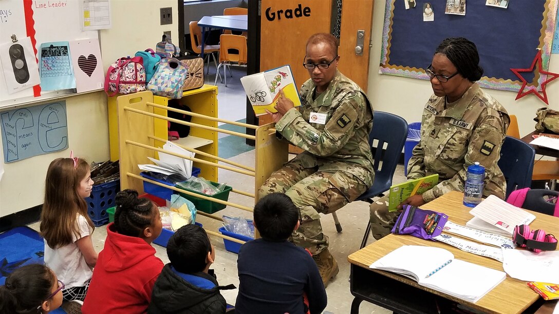 80th Training Command (TASS) U.S. Army Reserve Soldiers and Civilians enjoyed reading to Hopkins Road Elementary School children, celebrating National Read Across America Day, in honor of Dr. Seuss' birthday. Hopkins Elementary Reading Specialist Mrs. Christy Smith said that inviting the Soldiers to the school means a lot, not only to the kids, but to the parents and teachers as well. “Our kids look up to the Soldiers and see them as role models, and we absolutely love that,” said Smith.