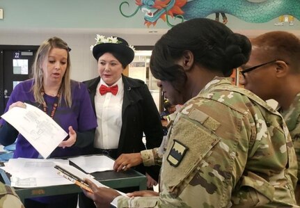 80th Training Command (TASS) U.S. Army Reserve Soldiers and Civilians enjoyed reading to Hopkins Road Elementary School children, celebrating National Read Across America Day, in honor of Dr. Seuss' birthday. Hopkins Elementary Reading Specialist Mrs. Christy Smith said that inviting the Soldiers to the school means a lot, not only to the kids, but to the parents and teachers as well. “Our kids look up to the Soldiers and see them as role models, and we absolutely love that,” said Smith.