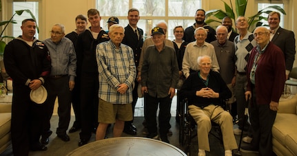 USS Charleston’s ship company stands with Vietnam, World War II and military veterans March 11, 2019, at the Somerby of Mount Pleasant, S.C., a senior living community.