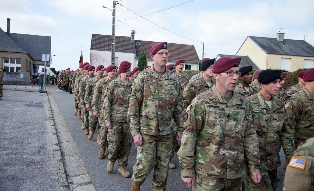 U.S. and German Soldiers in a ceremony at Montebourg, France