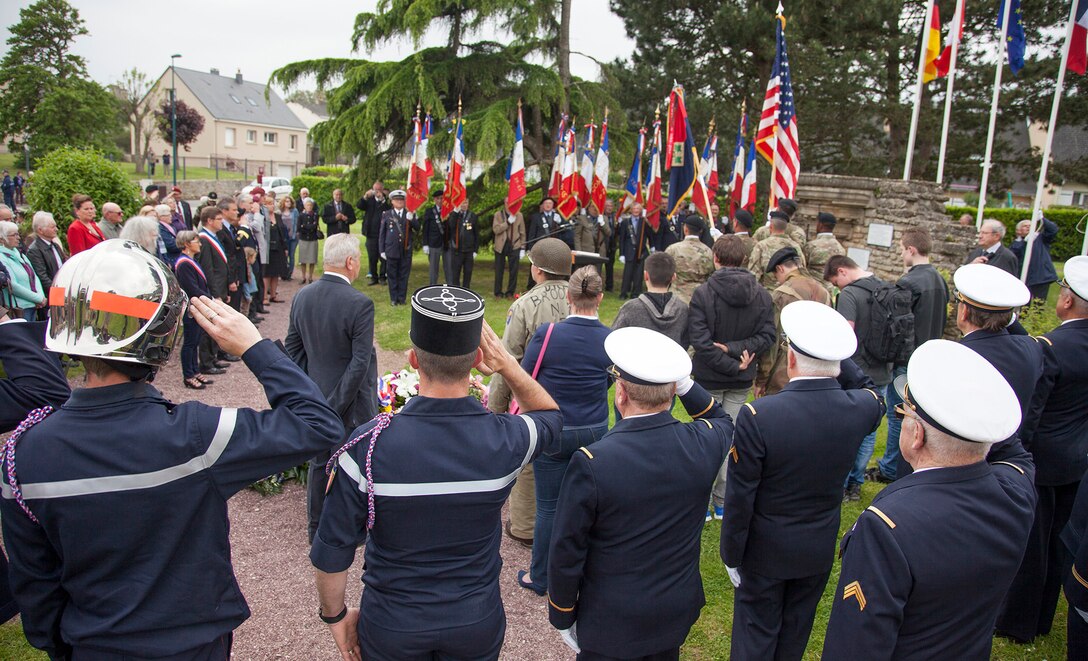 U.S., German and French dignitaries at a ceremony in Montebourg, France