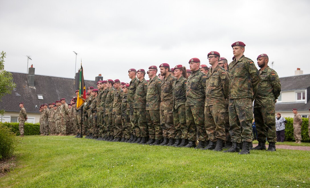U.S. and German Soldiers in a ceremony at Montebourg, France