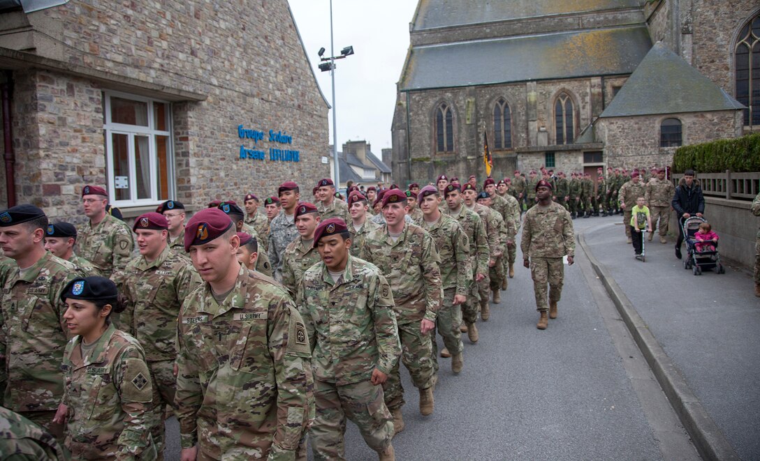 U.S. and German Soldiers in a ceremony at Montebourg, France