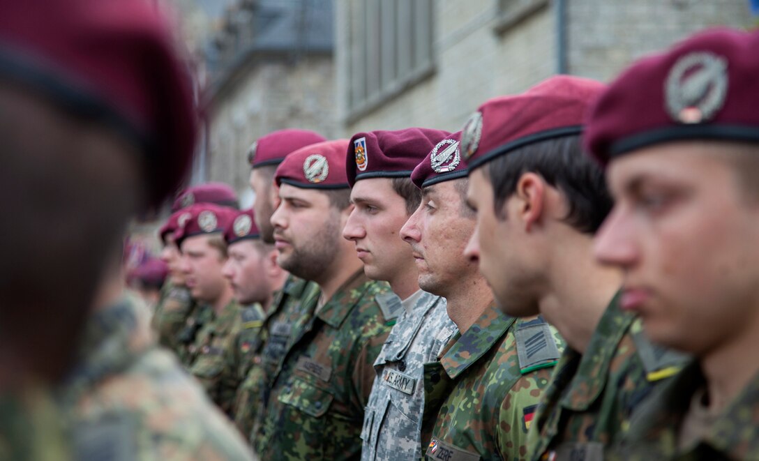 U.S. and German Soldiers in a ceremony at Montebourg, France