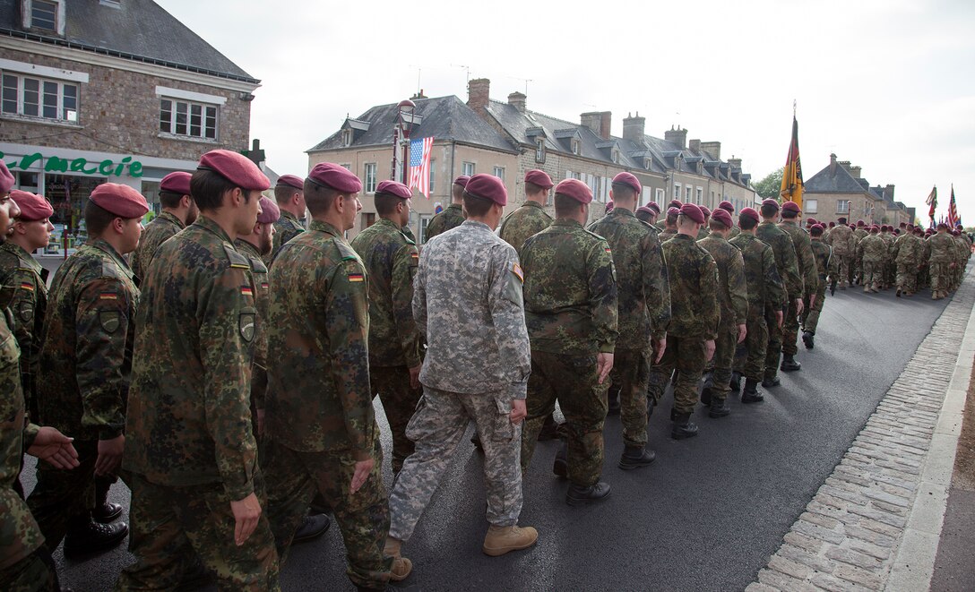 U.S. and German Soldiers in a ceremony at Montebourg, France