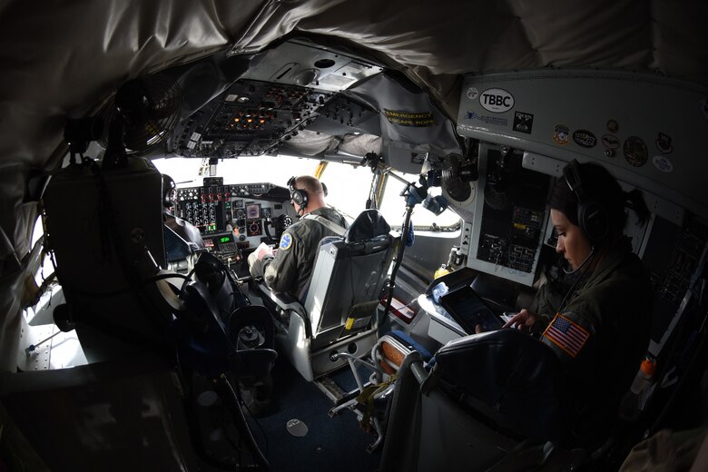 Airmen perform preflight checks on a KC-135
