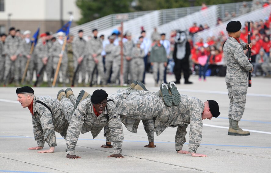 Members of the 335th Training Squadron freestyle drill team perform