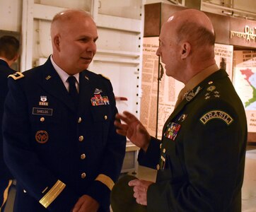New York National Guard Adjutant General, Maj. Gen. Raymond Shields, talks with Brazilian Army General Gerson Menandro Garcia De Freitas, before a state partnership signing, on the USS Intrepid, Manhattan, N.Y., March 14, 2019. The State Partnership between the NYNG and Brazil is a Department of Defense joint security cooperation program executed by the State Adjutants General in support of Combatant Commanders and U.S. Chiefs of Mission to help achieve security cooperation objectives and Department of Defense policy goals.