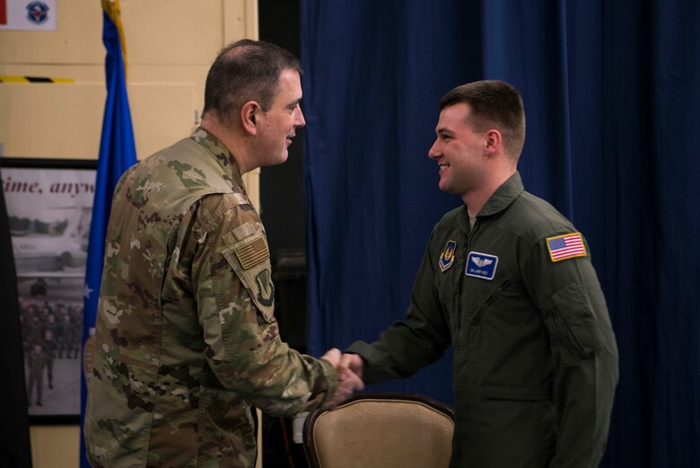U.S. Air Force Senior Airman Larry Nice, 86th Aeromedical Evacuation Squadron aeromedical evacuation technician, is recognized as Airlifter of the Week by Brig. Gen. Mark R. August, 86th Airlift Wing commander, on Ramstein Air Base, Germany, March 14, 2019. Nice was recognized for his leadership ability on a recent mission.