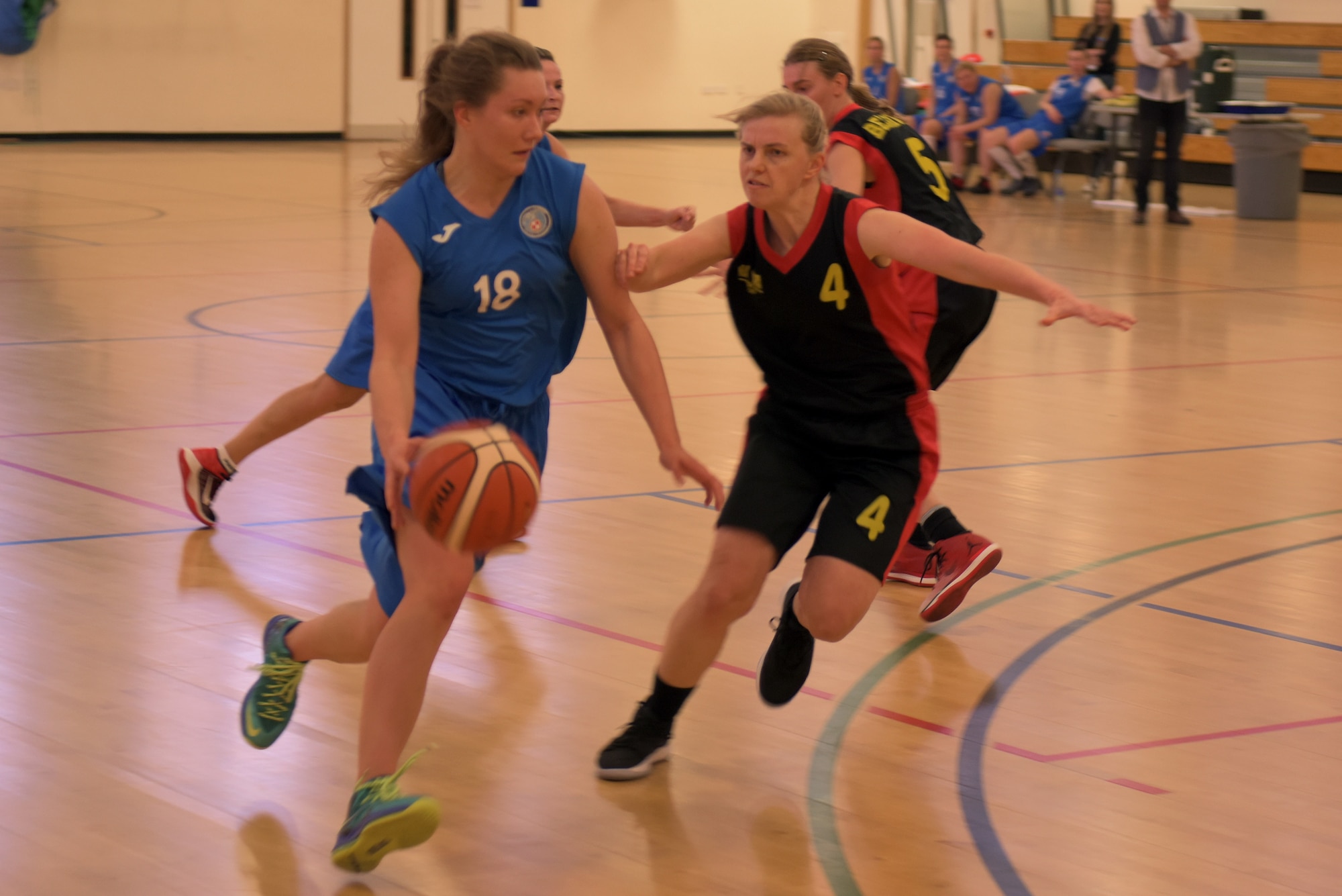 Polish air force 1st Officer Malgorzaia Urban drives through the Belgian air force defense at RAF Mildenhall, England, March 12, 2019. The Allied Air Command International Basketball Championship took place March 11 - 14, at RAF Mildenhall and RAF Lakenheath. (U.S. Air Force photo by Senior Airman Benjamin Cooper)
