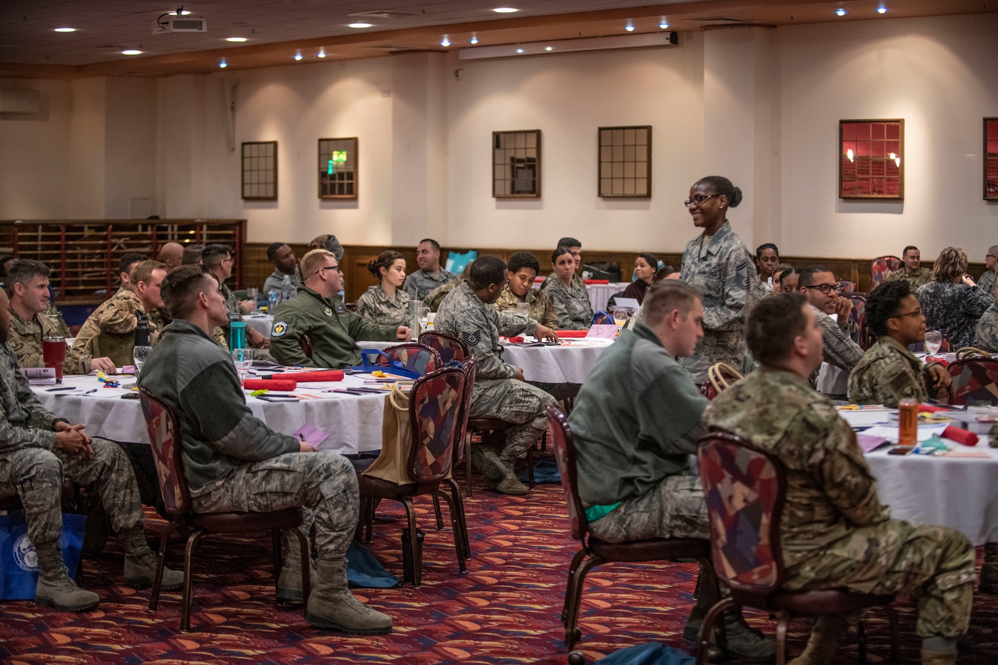 U.S. Air Force Senior Master Sgt. Terry Jackson, 100th Force Support Squadron lodging superintendent, interacts with Airmen at RAF Mildenhall, England, during an internationally broadcasted leadership enhancement event called “Leadercast” March 14, 2019. The theme of this year’s event was women leaders, and included CEOs, human rights activists and motivational speakers. (U.S. Air Force photo by Senior Airman Luke Milano)
