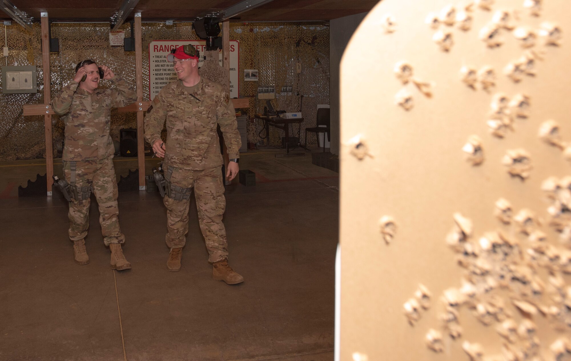 Senior Airman Hopper, 50th Security Force Squadron resource and logistics (left) and Senior Airman Spencer Thorpe, 50th Security Forces Squadron combat arms instructor, walk to inspect the target after Hopper’s line of fire at the 50th Security Forces shooting range at Schriever Air Force Base, Colorado, March 8, 2019. Hopper’s proficiency was being conducted in advance of an upcoming training event. (U.S. Air Force Photo by Staff Sgt. Matthew Coleman-Foster)