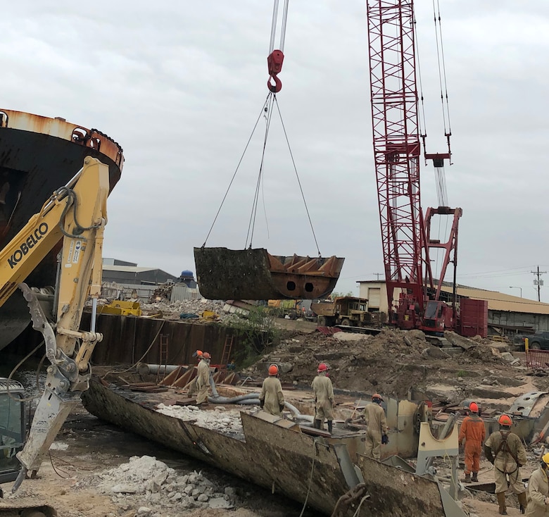 The STRUGIS project team commemorated the final section of the vessel being removed from the water and placed on the dock for sectioning into smaller pieces to be made available for recycling.  This milestone marks the completion of the decommissioning and dismantling of the STURGIS vessel