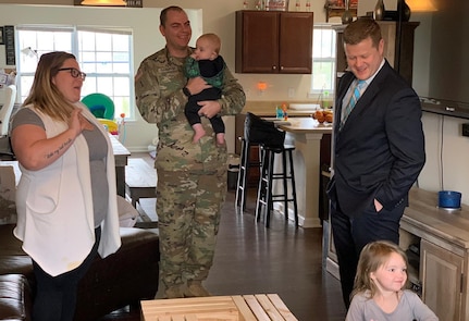 Under Secretary of the Army Ryan D. McCarthy (right) visits the home of a military family at Fort Jackson, South Carolina, Feb. 21, 2019. Senior leaders have recently visited several Army installations to hear concerns about military housing.