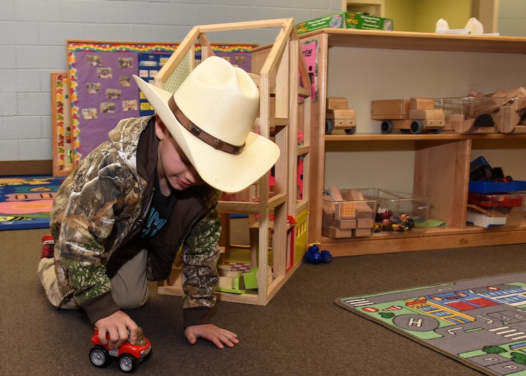 Brantley Cox plays with a toy truck at the Child Development Center on Goodfellow Air Force Base, Texas, March 15, 2019. Cox is one of the 118 children enrolled at the CDC. (U.S. Air Force photo by Airman 1st Class Abbey Rieves/Released)