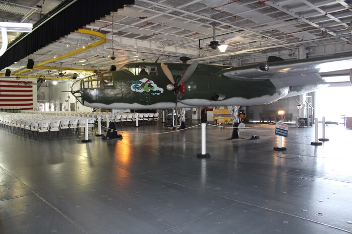 The B-25 “Furtle Turtle,” located on the hanger deck of the USS Yorktown at the Patriots Point Martime Museum in Mount Pleasant, S.C., sits supported by custom-built jack stands just before Airmen from the 437 Maintenance Group from Joint Base Charleston, S.C., reinstalled new wheels and tires.