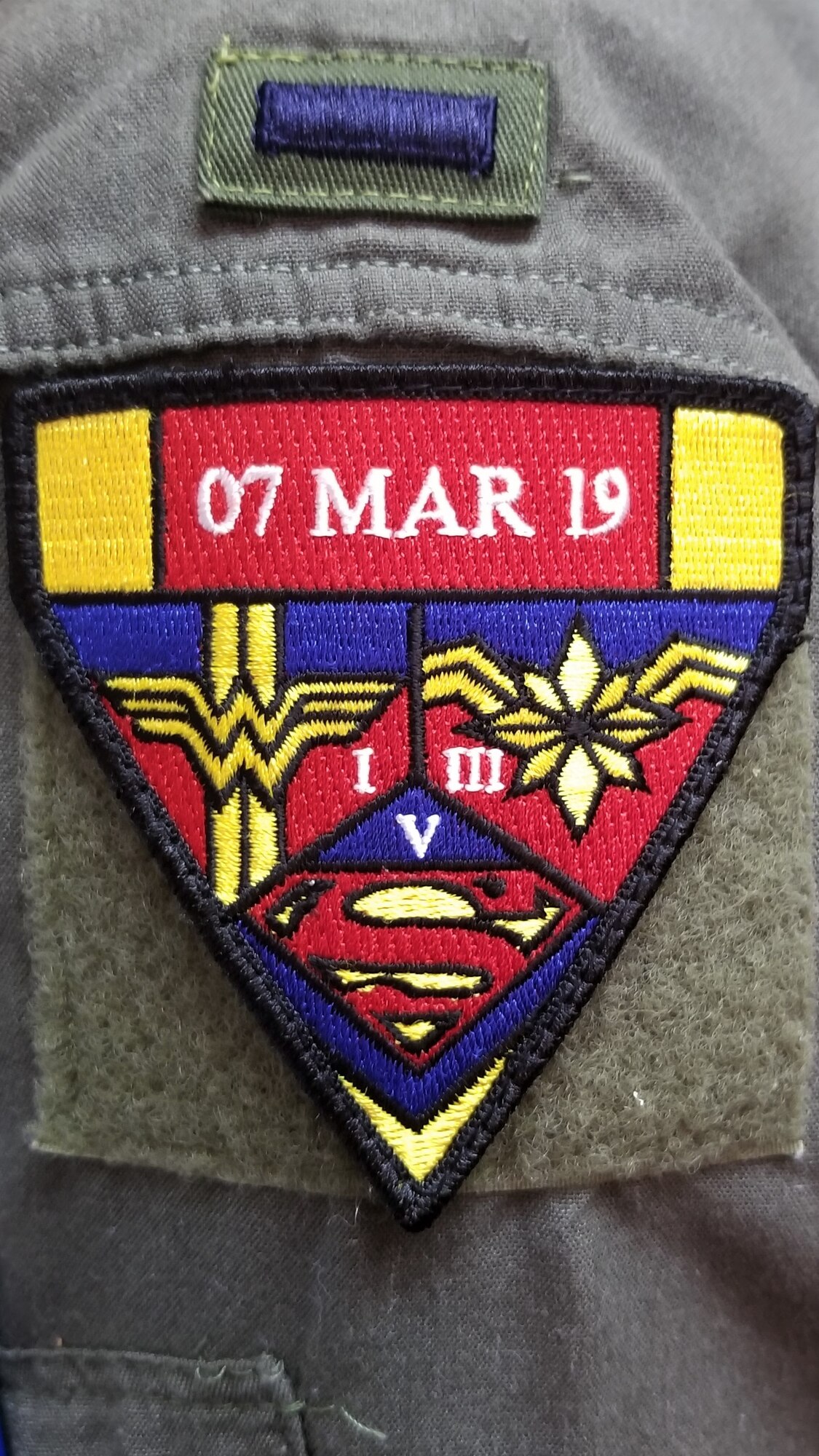 A morale patch designed for the all-female alert missileers at F.E. Warren Air Force Base, Wyo. March 7, 2019. The patch depicts the logos of famous comic book superheroes – Wonder Woman, Captain Marvel, and Superwoman. The 90th Missile Wing participated in an all-female alert during Women’s History Month. For 24 hours, female crews operated all ICBM silos across the United States. (Courtesy Photo)